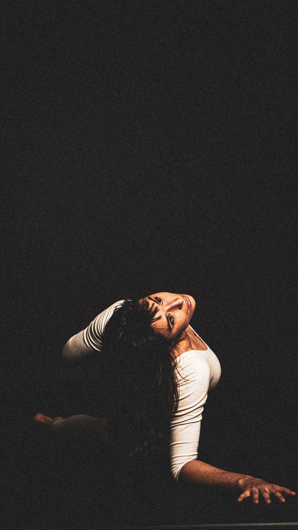 Dancer arching back with hair falling loose
