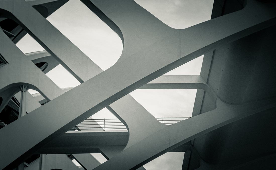 Abstract crossing concrete beams against the sky